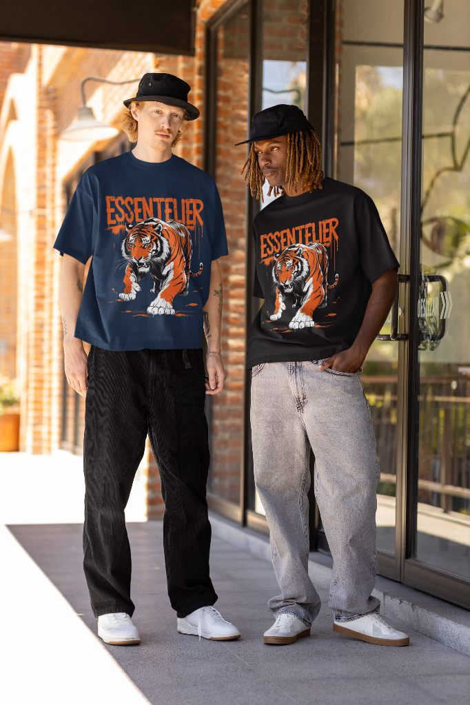 Two people wearing 'Essentelier' t-shirts with a tiger graphic outdoors.