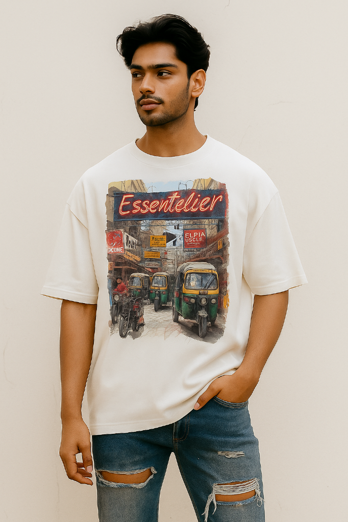 Person wearing a white t-shirt with a graphic design on a plain background